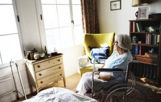 Senior woman sitting on the wheelchair alone