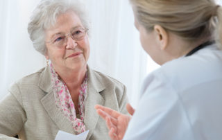 doctor explaining diagnosis to his female patient